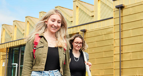 Two students walking through Severn Campus